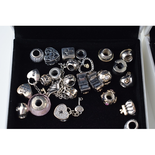 544 - Pandora: a collection of Pandora to include two bracelets and over 20 charms of varying styles and d... 