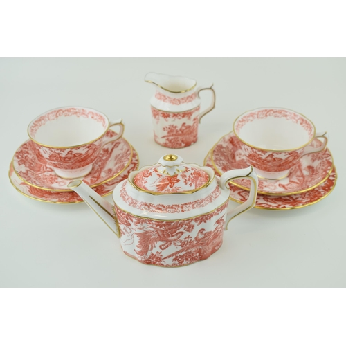 79 - Royal Crown Derby in the Red Aves pattern to include a small teapot, two trios and a cream jug (8).