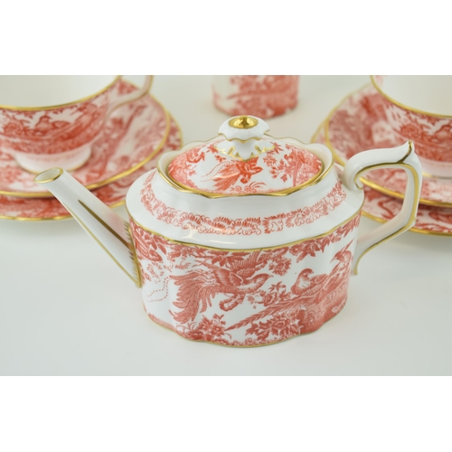 79 - Royal Crown Derby in the Red Aves pattern to include a small teapot, two trios and a cream jug (8).