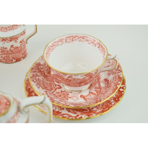 79 - Royal Crown Derby in the Red Aves pattern to include a small teapot, two trios and a cream jug (8).