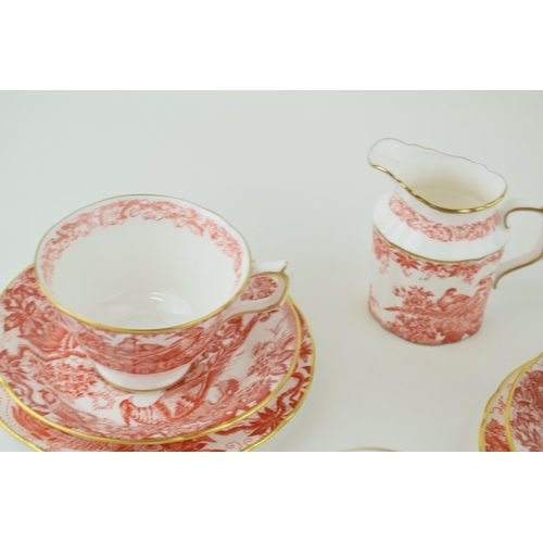 79 - Royal Crown Derby in the Red Aves pattern to include a small teapot, two trios and a cream jug (8).