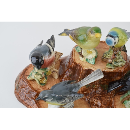 8 - A collection of Beswick Birds to include Blue Tit, 992, Bullfinch 1042, Greenfinch 2105, Whitethroat... 