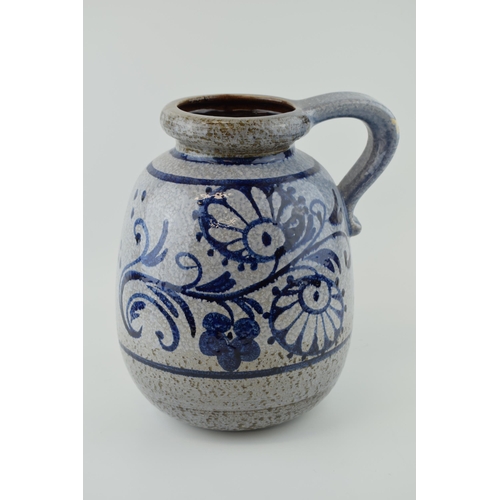 90A - A large West German pottery jug with Safi / Iznik style decoration, grey mottled glaze, 30cm tall.