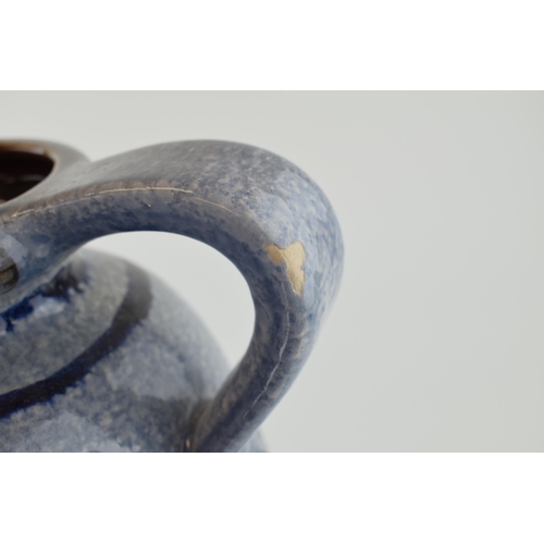 90A - A large West German pottery jug with Safi / Iznik style decoration, grey mottled glaze, 30cm tall.