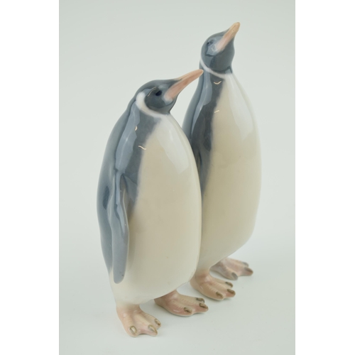 92 - Royal Copenhagen figure of two penguins, large size, 2918, by Theodor Madsen, 18.5cm tall (1 beak re... 