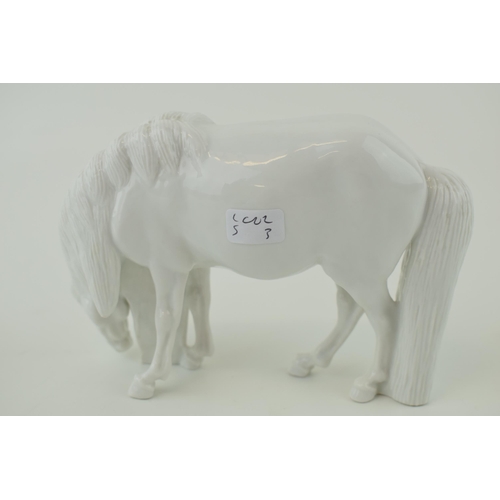 99 - Royal Copenhagen model of a grazing horse, facing right, blanc de chine, 15.5cm long.