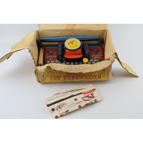 150 - A boxed 'Mettype' tin toy typewriter