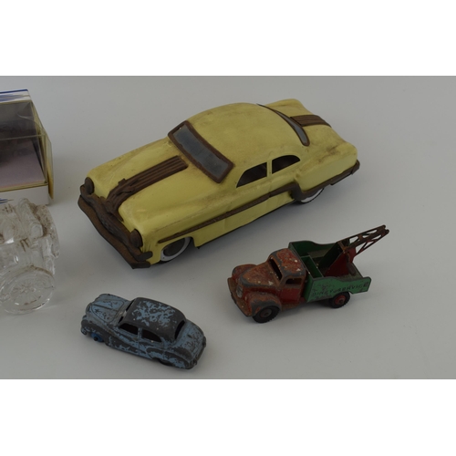 151 - A mixed collection of vintage toys to include 50s style plastic / celluloid car and vintage 'Dinky T... 