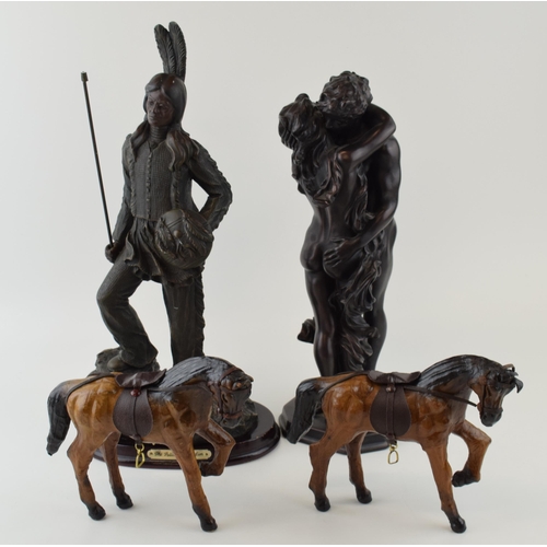 4 - A collection of decorative items to include bronzed resin figures and leather horses. (4)