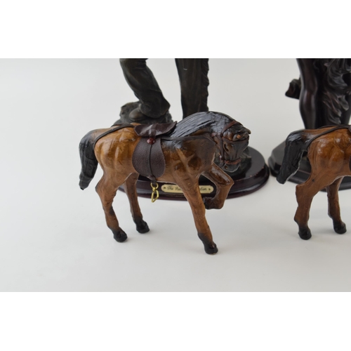 4 - A collection of decorative items to include bronzed resin figures and leather horses. (4)