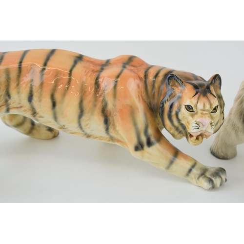 56 - Melba Ware pottery animals to include a large stalking tiger and two dogs, longest 41cm long (3).