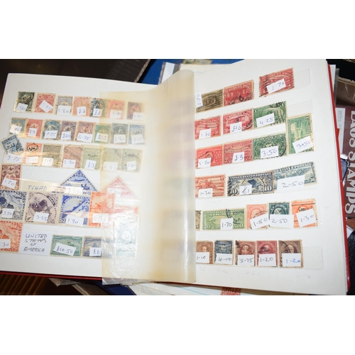 77 - A large quantity of vintage Uk and world stamps, multiple albums. (Qty)