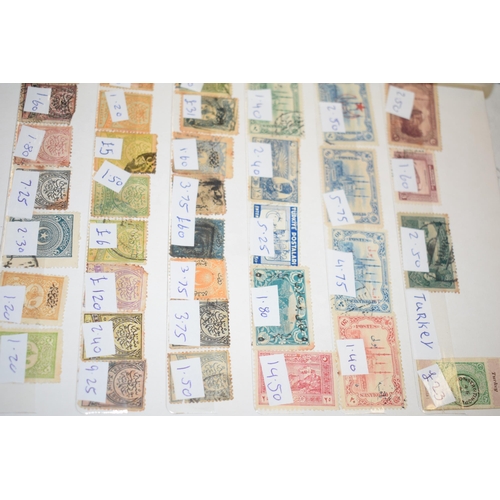 77 - A large quantity of vintage Uk and world stamps, multiple albums. (Qty)