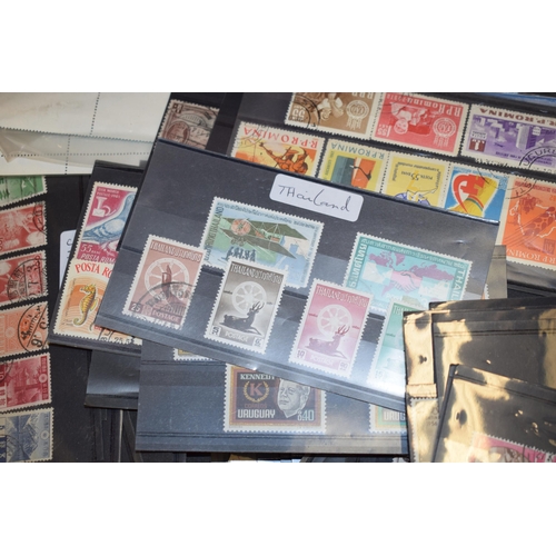 80 - A large quantity of vintage Uk and world stamps, multiple sleeves. (Qty)