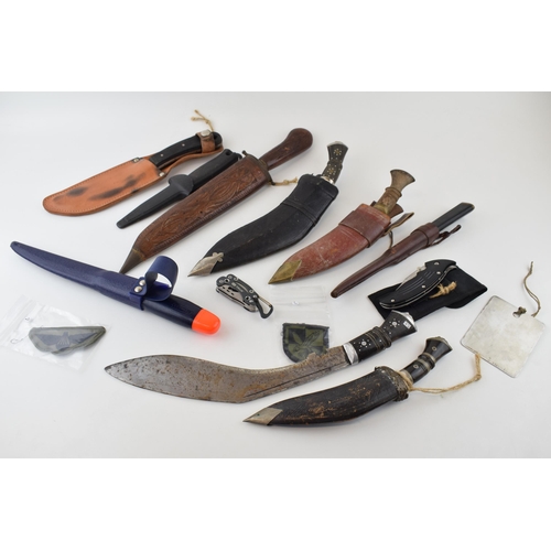 84 - A collection of vintage knives to include sheath knives, hunting knives and Gurkha style Kukhri kniv... 