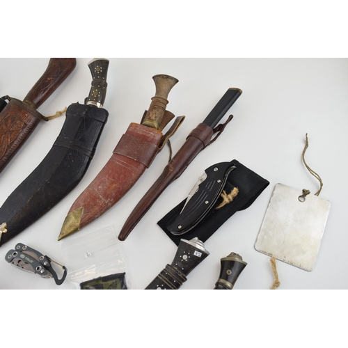 84 - A collection of vintage knives to include sheath knives, hunting knives and Gurkha style Kukhri kniv... 