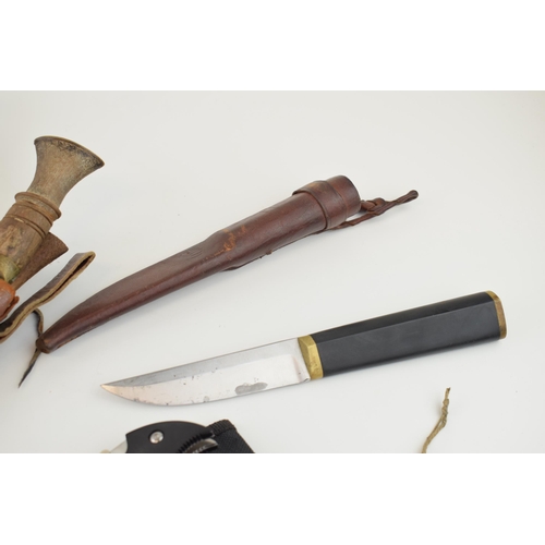 84 - A collection of vintage knives to include sheath knives, hunting knives and Gurkha style Kukhri kniv... 