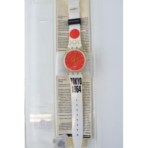 85 - A Swatch Tokyo 1964 watch with box and paperwork.