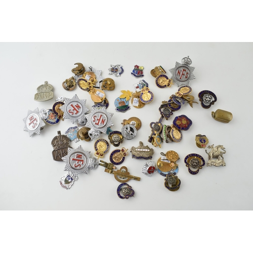 91 - A collection of vintage enamel badges to include NFS, British Legion Civil Defence Corps and other s... 