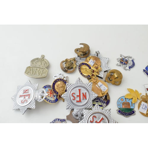 91 - A collection of vintage enamel badges to include NFS, British Legion Civil Defence Corps and other s... 