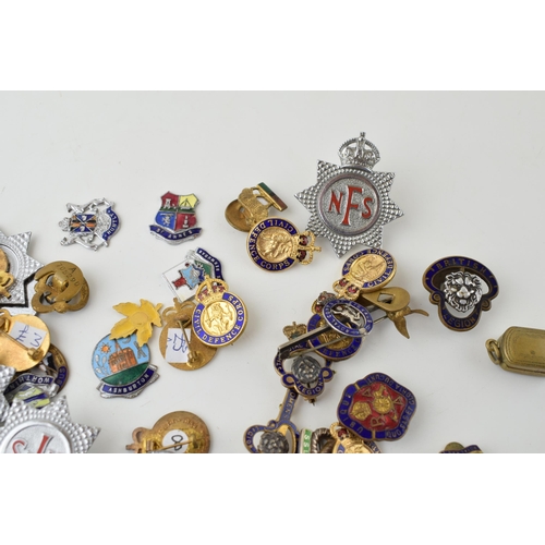 91 - A collection of vintage enamel badges to include NFS, British Legion Civil Defence Corps and other s... 