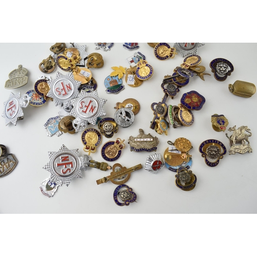 91 - A collection of vintage enamel badges to include NFS, British Legion Civil Defence Corps and other s... 