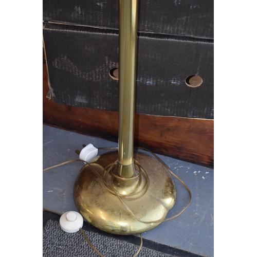 132 - A mid to late 20th century brass tall freestanding lamp base, with glass shade, resembles Olympic to... 