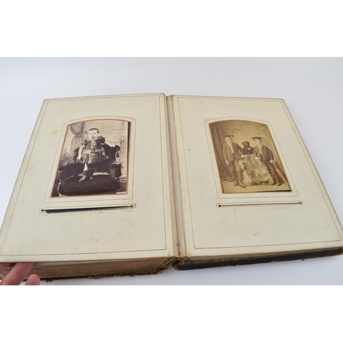 141 - A 19th century photograph album 'The Balmoral Album' to include family photographs, gentleman in mil... 