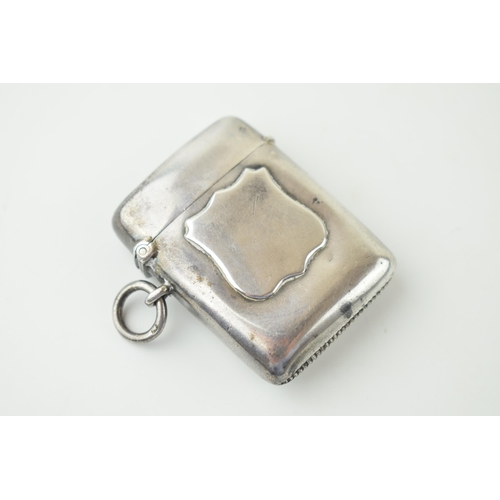 158 - Hallmarked silver vesta case, raised shield cartouche, 25.5g, Birm 1876.