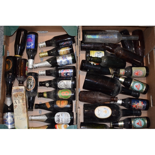 188 - A good collection of beer bottles to include 'Bass', 'Guiness', 'Bank's' and other breweries. (Qty) ... 