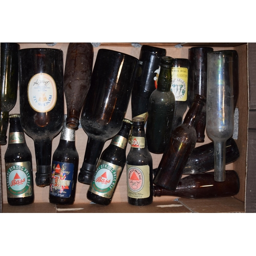 188 - A good collection of beer bottles to include 'Bass', 'Guiness', 'Bank's' and other breweries. (Qty) ... 