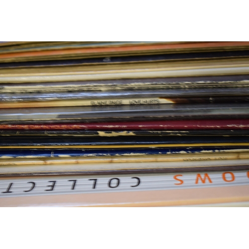 176 - A large quantity of LP records to include rock and pop records of the 70s and 80s. (Qty)