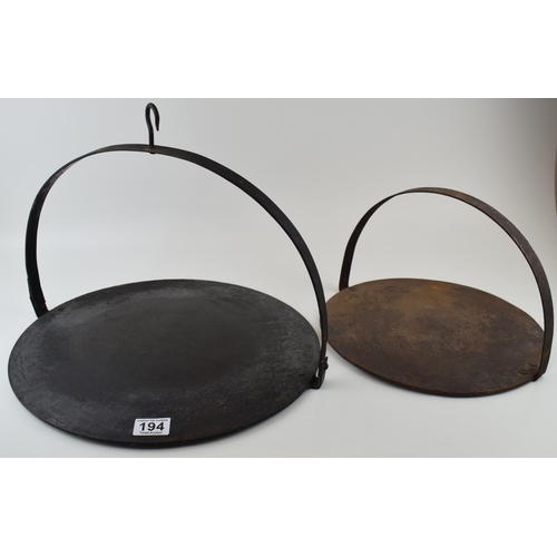 194 - A pair of antique Victorian cast iron skillets