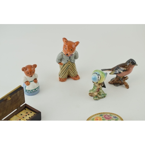 201 - A mixed collection of items to include two Beswick birds, a compact, two teddy bear figures and a bo... 