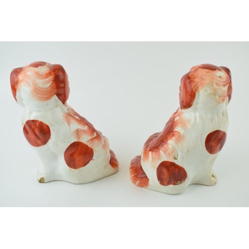 182 - A pair of Staffordshire dogs, with baskets of flowers in mouths, 16cm tall (2).