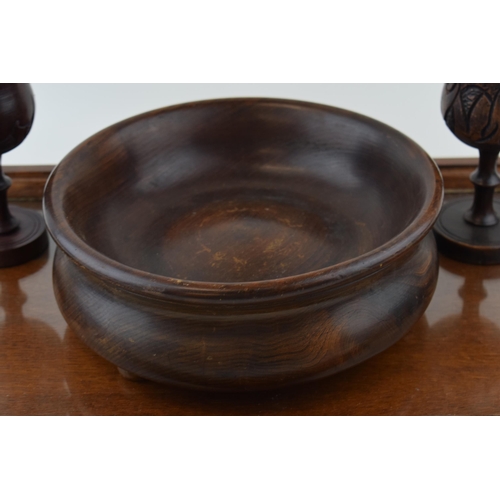 210 - A wooden butlers tray with glass liner, a turned wooden fruit bowl with a near pair of carved goblet... 