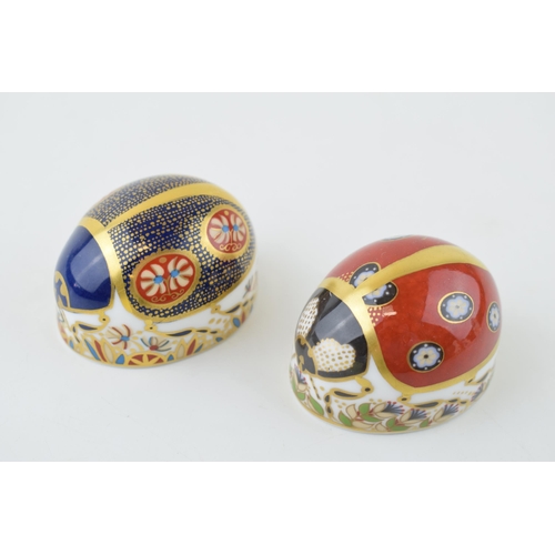 215 - Royal Crown Derby paperweight of a red ladybird with seven spots with a blue ladybird (af), first qu... 