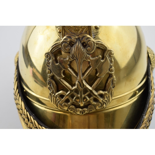 224 - Large brass fireman's helmet, crest to front, with chin strap, 37cm long.