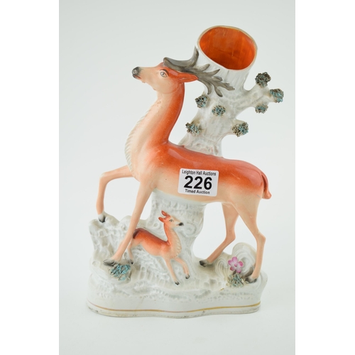 226 - Staffordshire spill vase in the form of a stag with fawn, 30cm tall.