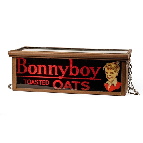 Early 20th century adverting light box for shop window display. 'BONNYBOY TOASTED OATS'. Original chains and glass. Designed with a mirror on a 45 degree angle so that sunlight illuminated the thick red glass front. Originally hung in a shop window in Cheadle, Staffordshire. Bonnyboy Oats were part of the Spillers group during the 1920s and 1930s. c1920s. 64cm x 26cm x 23cm.