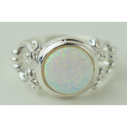 240 - Sterling silver contemporary ring, set opal style insert.