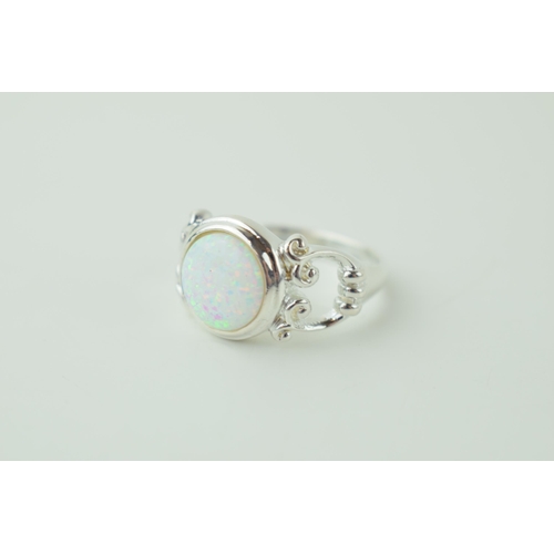 240 - Sterling silver contemporary ring, set opal style insert.