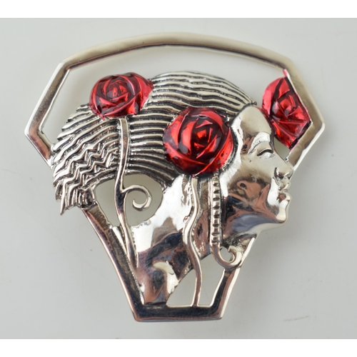 243 - Sterling silver contemporary Art Nouveau style brooch of a lady with red enamelled roses, 45mm wide.