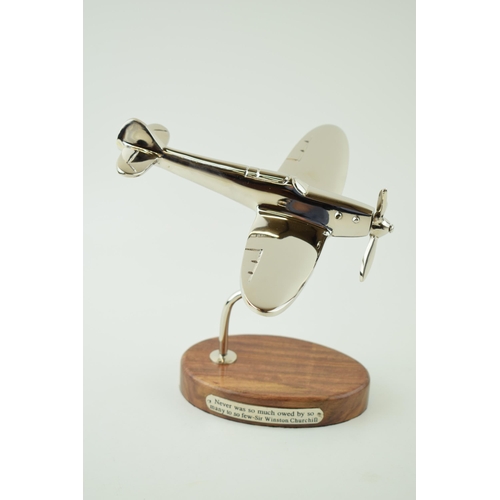 244 - Reproduction model of a WWII Spitfire plane, mounted on wooden base, engraved plaque with a Sir Wins... 