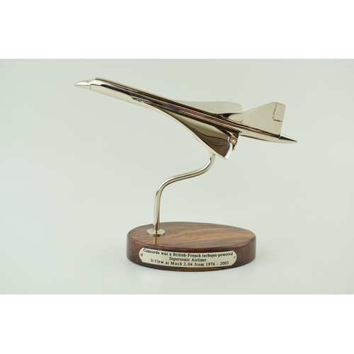 245 - Reproduction model of Concorde, wooden base, engraved plaque, 18.5cm tall.