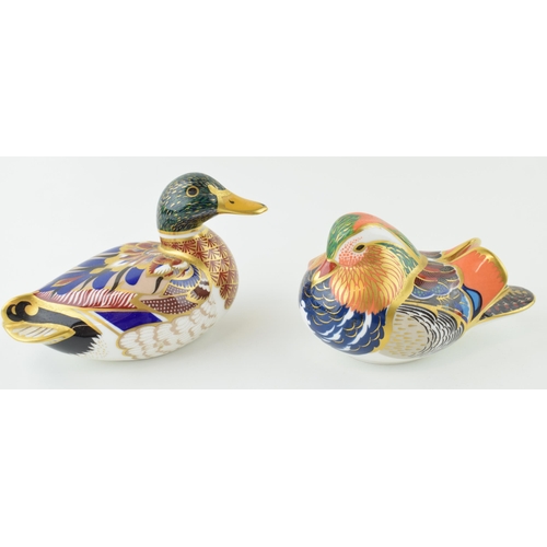 274 - Two Royal Crown Derby paperweights to include a Mallard and a Mandarin Duck, silver stoppers. Height... 