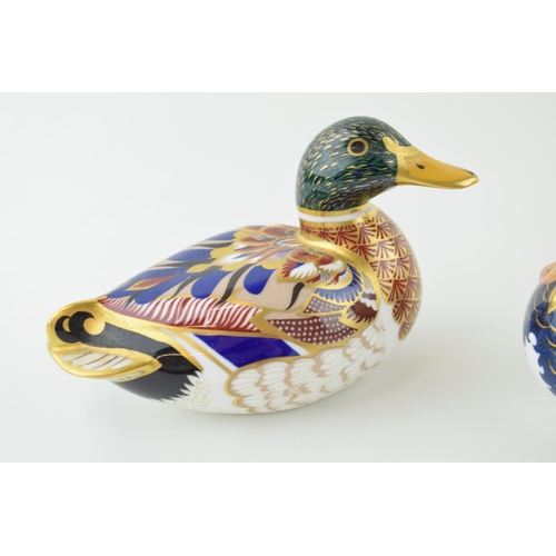 274 - Two Royal Crown Derby paperweights to include a Mallard and a Mandarin Duck, silver stoppers. Height... 