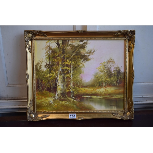 286 - F Holger, Oil on Canvas, Forrest scene with pond in gilt frame. 39cm x 49cm.