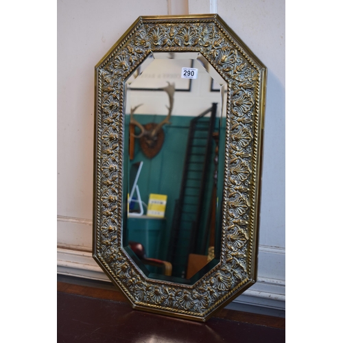 290 - A bevelled edge glass mirror with brass frame. 76cm x 45cm.