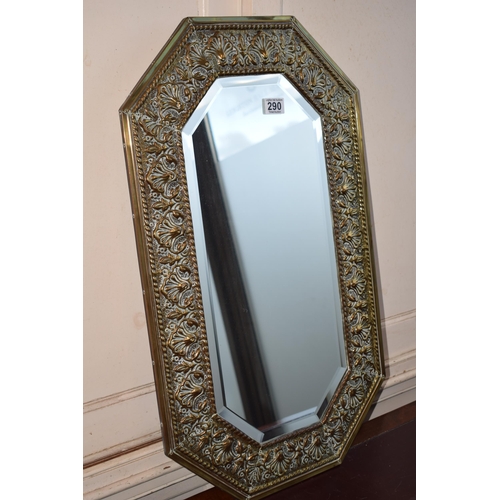 290 - A bevelled edge glass mirror with brass frame. 76cm x 45cm.